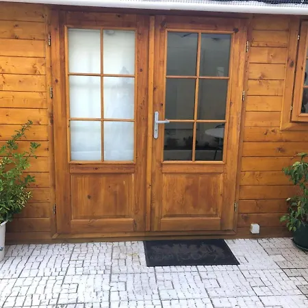 Small Wooden With Green Roof *